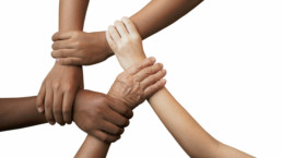 5 different shades of hands holding the wrist of the person next to them to form a 5-hand bond